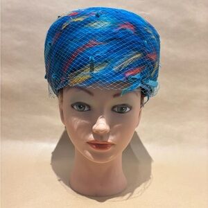 Elegant Blue Hat with Feather and Veil